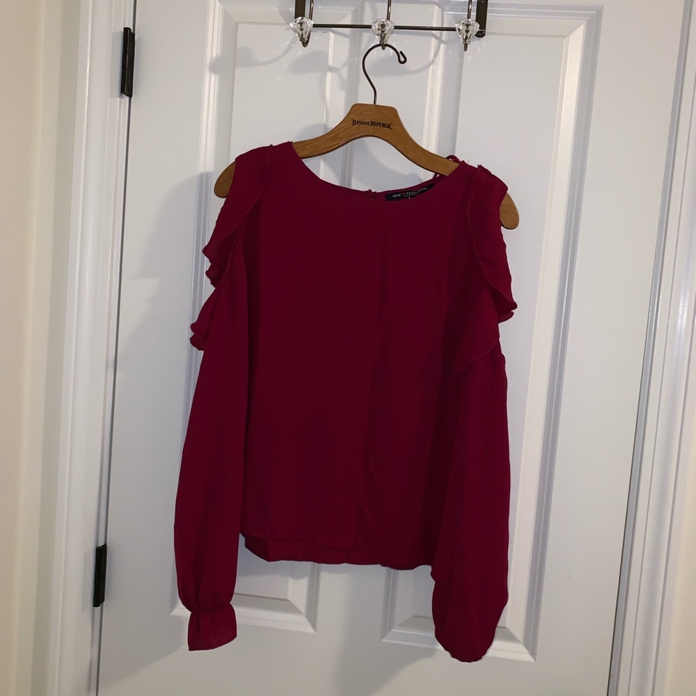 Plum colored blouse with cut out shoulders